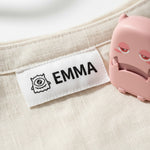 Close-up of child's name stamped onto school shirt collar — waterproof ink
