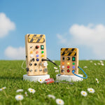 Both Mini and Large PowerBoard variants upright — wooden LED busy board for kids
