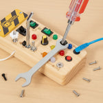 Flat lay of PowerBoard with wrench and screwdriver tools — Parent Nest STEM toy