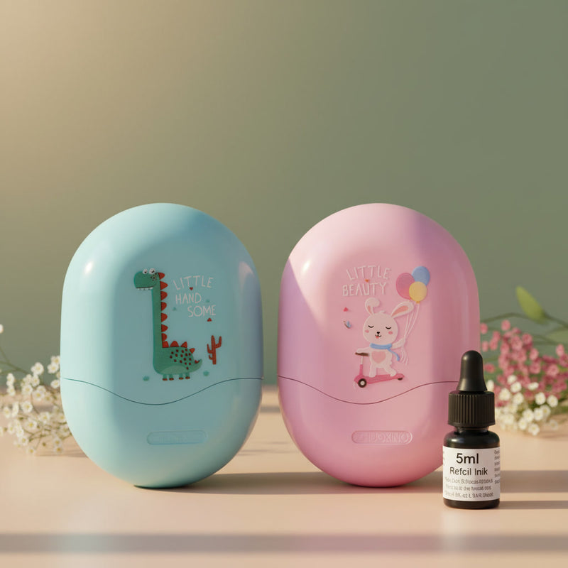 Two Hatch Nest egg-shaped personalised name stamps side by side — blue dinosaur and pink bunny